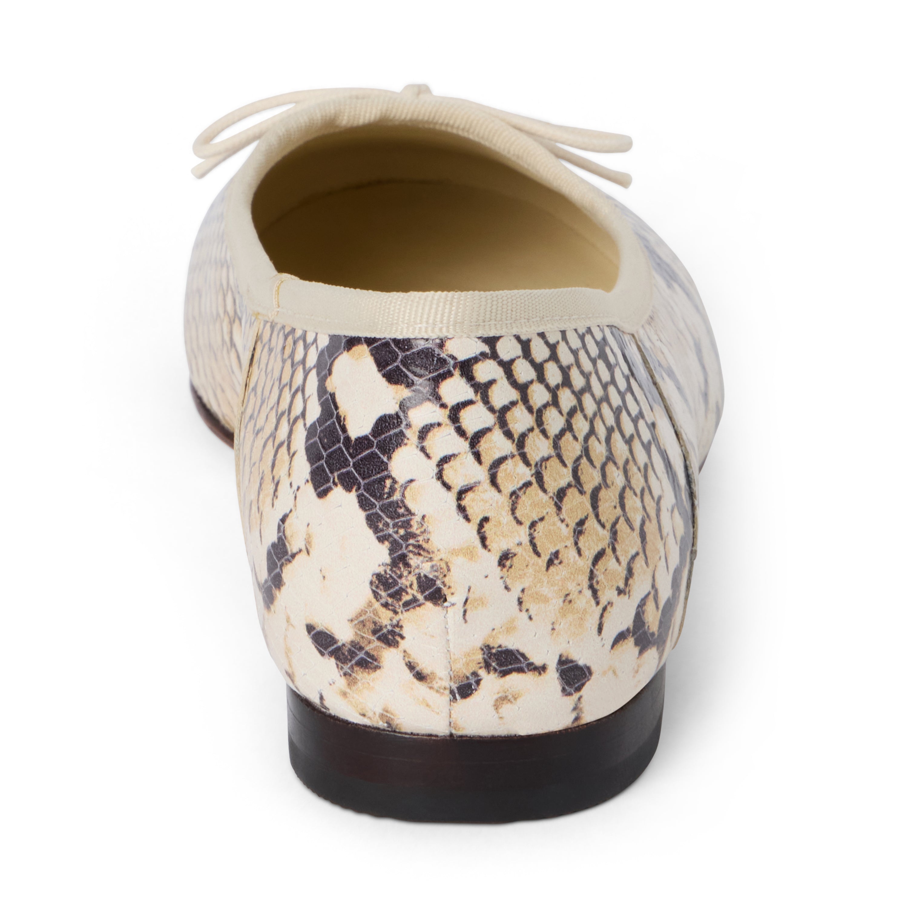 Tan, brown, and black snake-print leather ballet flat with an ivory bow, rounded toe, tonal trim, and low heel shown on a white background.