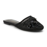 Black mesh mule with floral embellishments, slip-on design, low flat sole, and pointed toe, shown on a white background.
