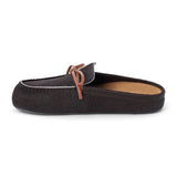 Dark brown cow hair clog with a moc-style apron toe, decorative leather bow, and backless silhouette shown on a white background.