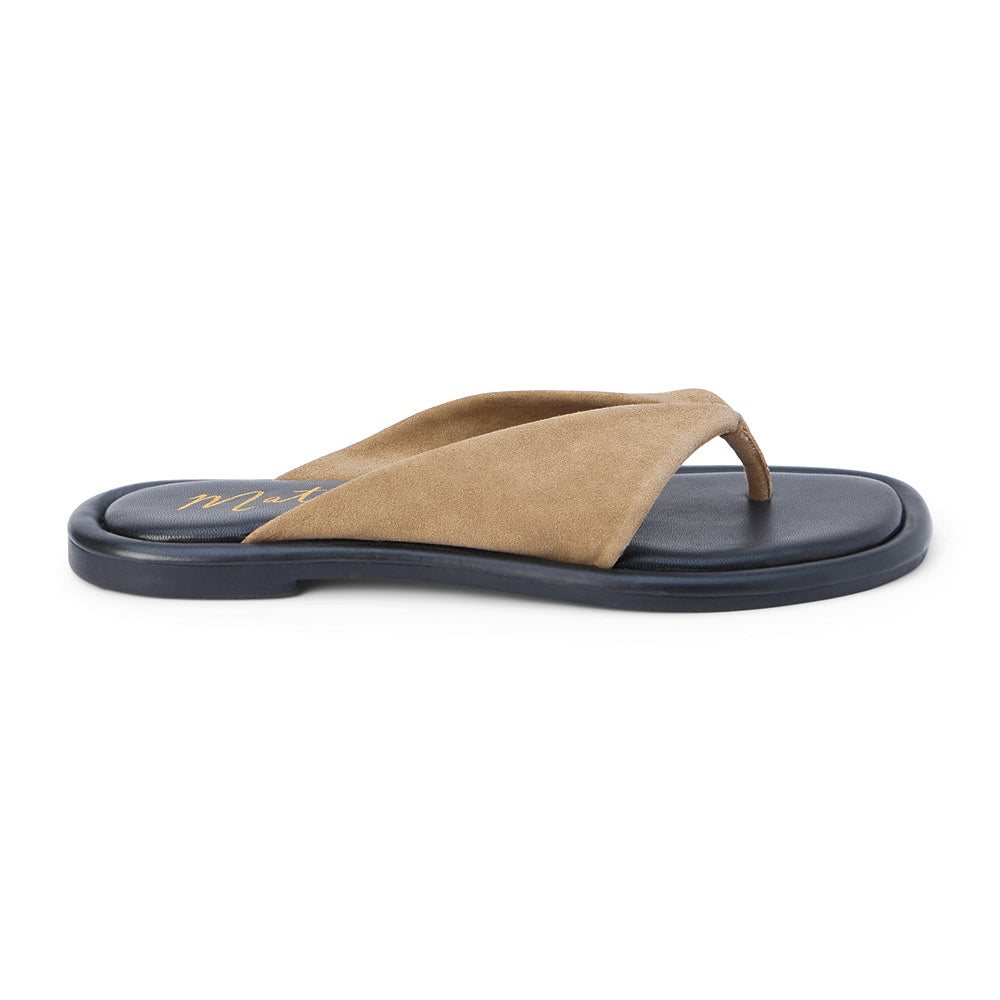 Tan suede flip flop sandal with wide strap and toe loop shown on a white background.