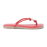 Red leather thong sandal with metal ring detail and flat sole shown on a white background.