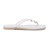 Ivory leather thong sandal with metal ring detail and flat sole shown on a white background.