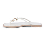 Ivory leather thong sandal with metal ring detail and flat sole shown on a white background.