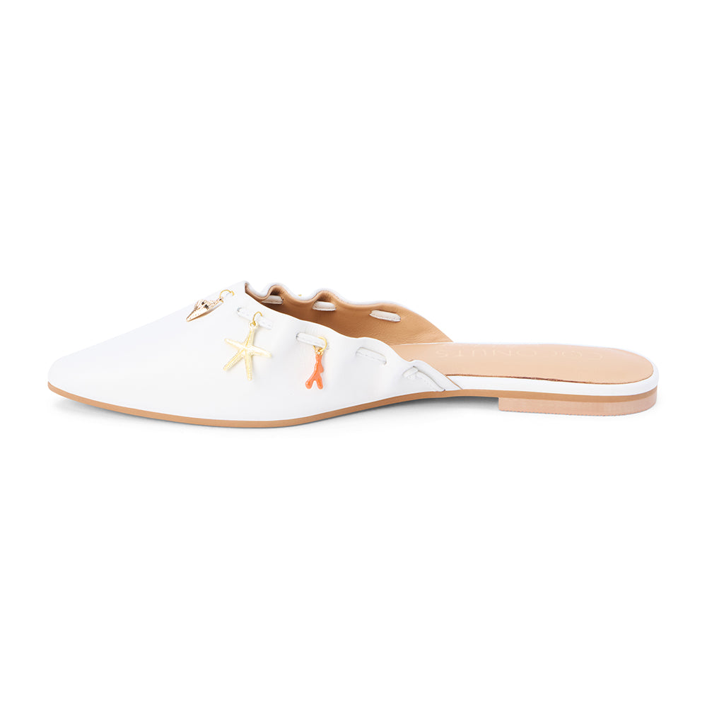 White leather mule with scalloped edges and decorative charms shown on a white background.