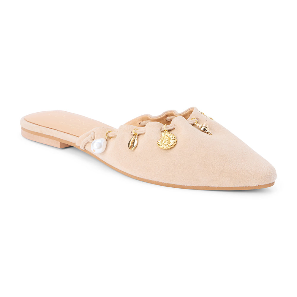 Tan suede mule with scalloped edges and decorative charms shown on a white background.