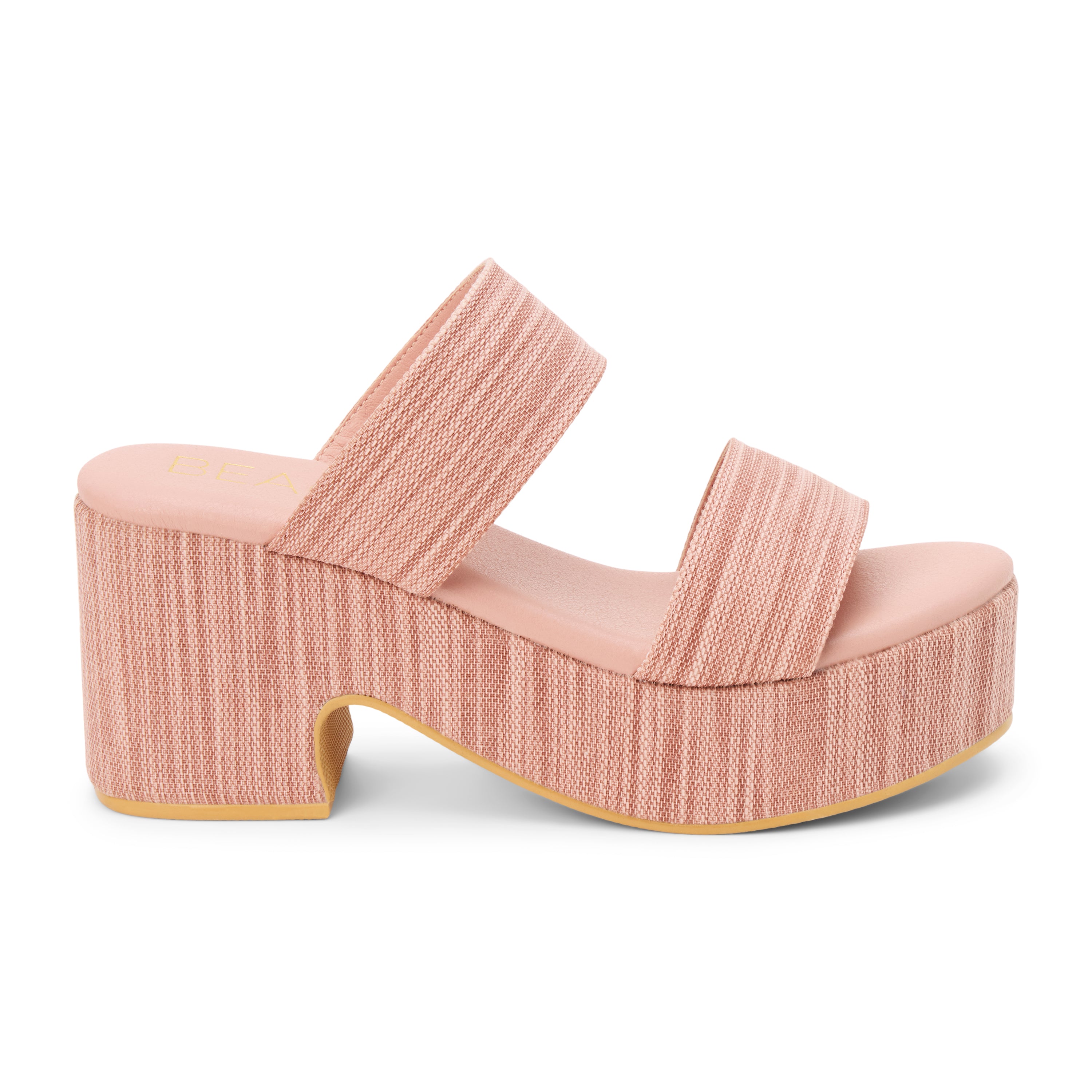 Light pink platform sandal with wide double straps and a sculpted heel, shown on a white background.