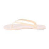 Nude PVC jelly flip flop sandal with glossy straps, open toe, and flat sole, shown on a white background.