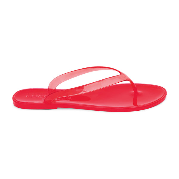 Olsen Flip Flop Sandal – Coconuts by Matisse – Red translucent jelly flip flops with a minimalist dual-strap design and glossy finish. Lightweight, flexible, and perfect for beach days or casual summer outings.