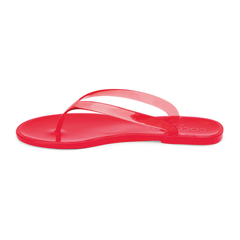 Olsen Flip Flop Sandal – Coconuts by Matisse – Red translucent jelly flip flops with a minimalist dual-strap design and glossy finish. Lightweight, flexible, and perfect for beach days or casual summer outings.