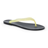 Light yellow and black PVC jelly flip flop sandal with translucent straps, open toe, and flat sole, shown on a white background.