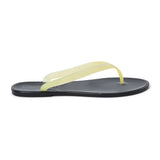 Light yellow and black PVC jelly flip flop sandal with translucent straps, open toe, and flat sole, shown on a white background.