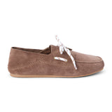 Light brown suede moc-toe boat shoe with lace-up detail and low-profile sole, shown on a white background.