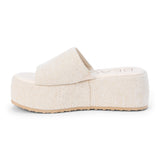 Light gray speckled jute platform slide sandal with a wide woven strap and flatform sole, shown on a white background.