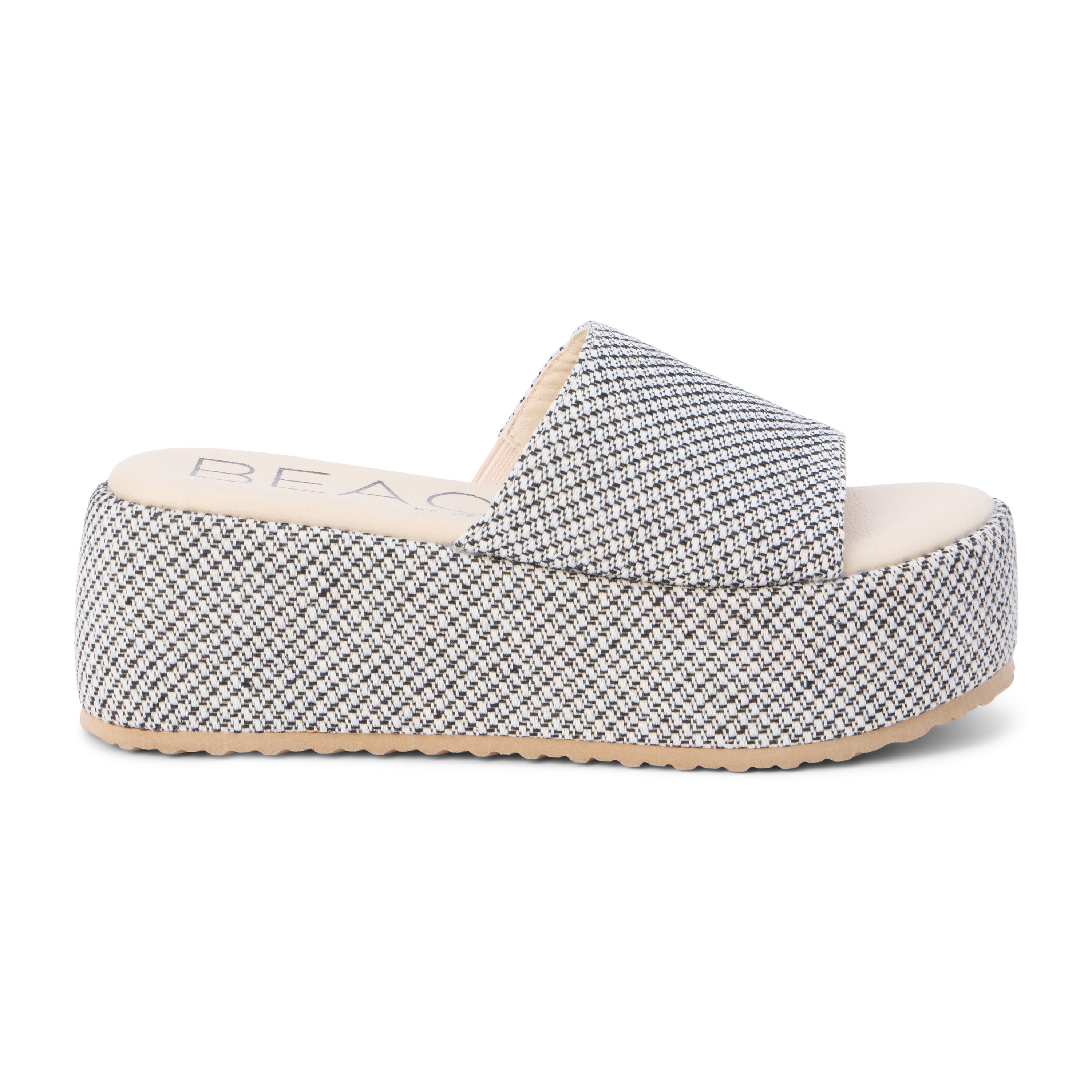 White and black jute platform slide sandal with a wide woven strap and flatform sole, shown on a white background.