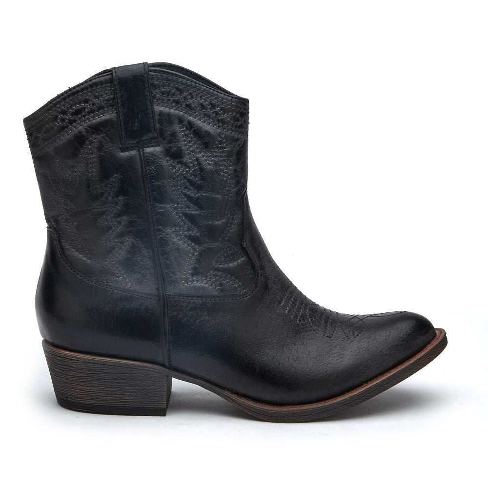 Vegan black textile Western boot with decorative stitching, a pointed toe, distressed finish, and stacked block heel shown on a white background.