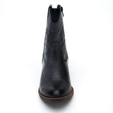 Vegan black textile Western boot with decorative stitching, a pointed toe, distressed finish, and stacked block heel shown on a white background.