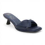 Navy vegan faux leather heeled sandal with knotted bow detail and slim heel, shown on a white background.