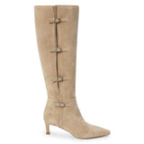 Tan suede knee-high boot with four silver-tone buckle accents, a pointed toe, and slim tan kitten heel shown on a white background.