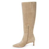 Tan suede knee-high boot with four silver-tone buckle accents, a pointed toe, and slim tan kitten heel shown on a white background.