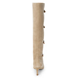 Tan suede knee-high boot with four silver-tone buckle accents, a pointed toe, and slim tan kitten heel shown on a white background.