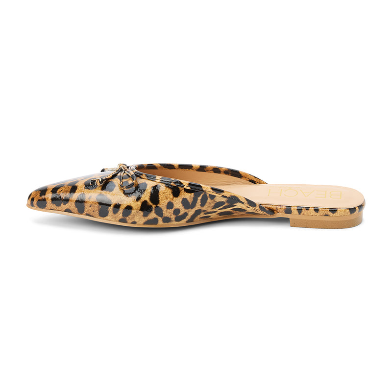 Reggie Vegan Pointed Toe Mule – Beach by Matisse – Faux patent leather leopard print flat mule with pointed toe and petite bow detail.