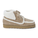 Vegan tan faux suede ankle boot with white faux-fur trim, wraparound lacing, a rounded moc toe, and lug sole shown on a white background.