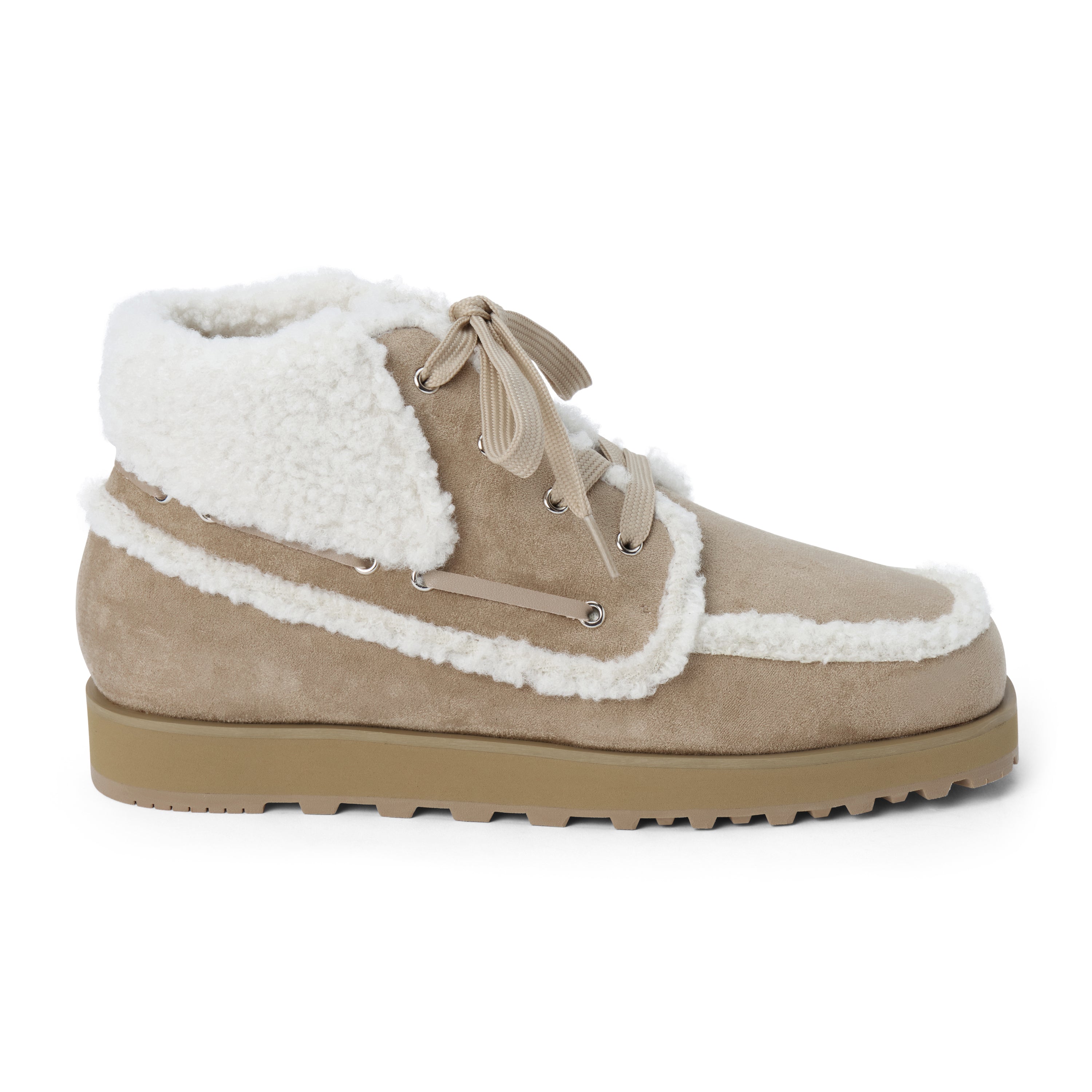Vegan tan faux suede ankle boot with white faux-fur trim, wraparound lacing, a rounded moc toe, and lug sole shown on a white background.
