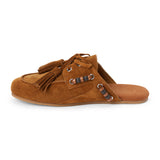 Brown suede mule with an open back, moc-toe stitching, lace-up tassels, contrasting wood bead accents, and a flat sole shown on a white background.