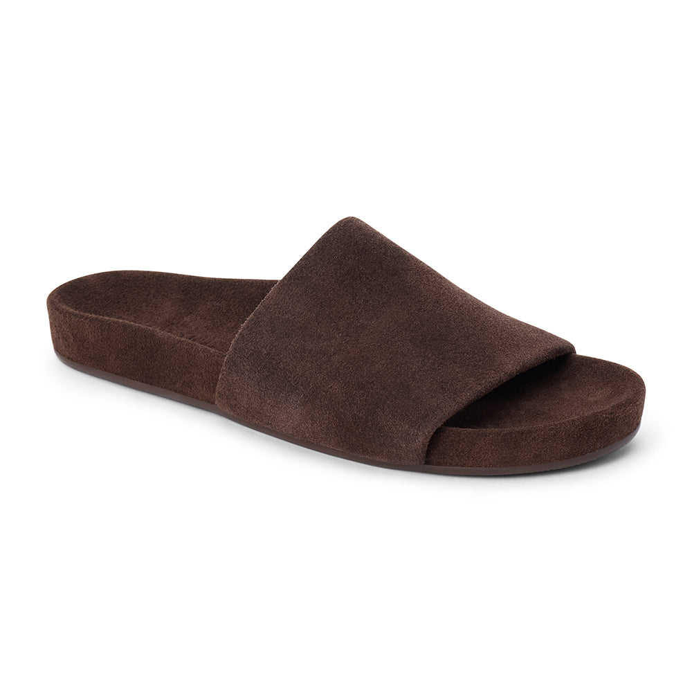 Espresso brown suede flat slide sandal with wide strap and molded footbed, shown on a white background.