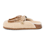 Vegan ivory faux shearling mule with a tan tassel accent, ornate bronze-tone buckle, open back, and flat sole shown on a white background.