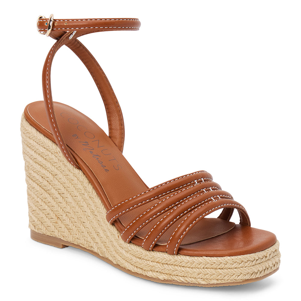 Brown vegan faux leather wedge sandal with ankle strap and braided platform heel shown on a white background.