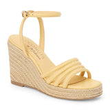 Light yellow vegan faux leather wedge sandal with ankle strap and braided platform heel shown on a white background.