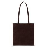 Brown suede tote bag with a rectangular body, soft matte finish, and two long matching shoulder straps shown on a white background.