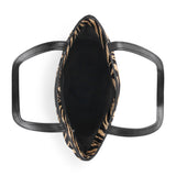 Top-down view of a black leather handbag with a black and tan zebra print lining, set against a plain white background.