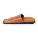 Brown leather slide sandal with wide strap and open toe shown on a white background.