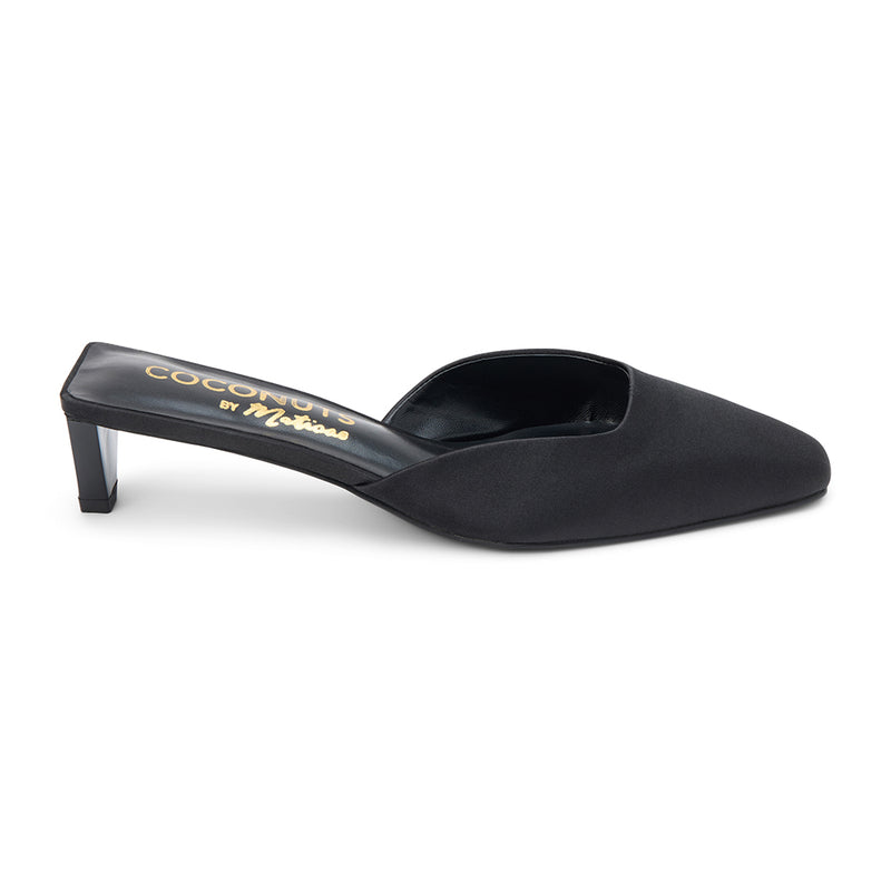 Black satin mule heels with a pointed toe and sleek slip-on design. A sophisticated staple for effortless elegance and modern styling.