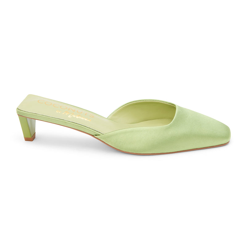 Soft green satin mule heels with a pointed toe and sleek slip-on design. A sophisticated staple for effortless elegance and modern styling.