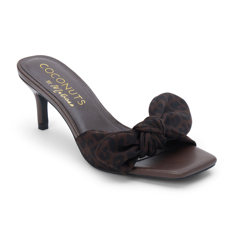 Uptown Vegan Heeled Sandal – Coconuts by Matisse – Brown slip-on sandal with square toe, leopard print bow strap, and tapered kitten heel.