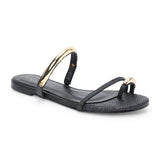 Black raffia flat sandal with slim straps and gold-tone hardware, shown on a white background.