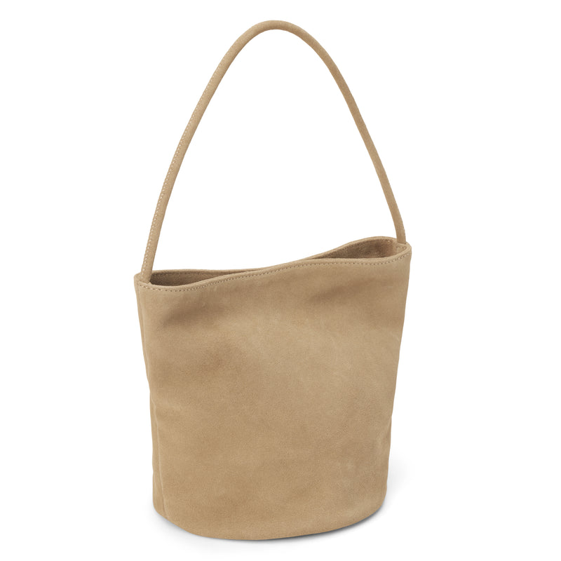 Vancouver Bucket Bag - Matisse Footwear - Minimalist bucket bag in soft beige colored suede with a seamless silhouette and a single shoulder strap. A versatile and unstructured carryall with effortless, elevated appeal.