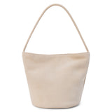 A beige suede bucket bag with a single shoulder strap and relaxed silhouette shown on a white background.