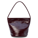 A burgundy textured leather bucket bag with a single shoulder strap and structured shape shown on a white background.