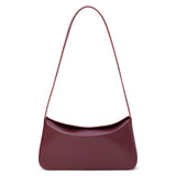 Dark red leather shoulder bag with a structured silhouette and slim strap, shown on a white background.
