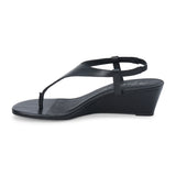 Black leather wedge sandal with slingback strap and open toe shown on a white background.
