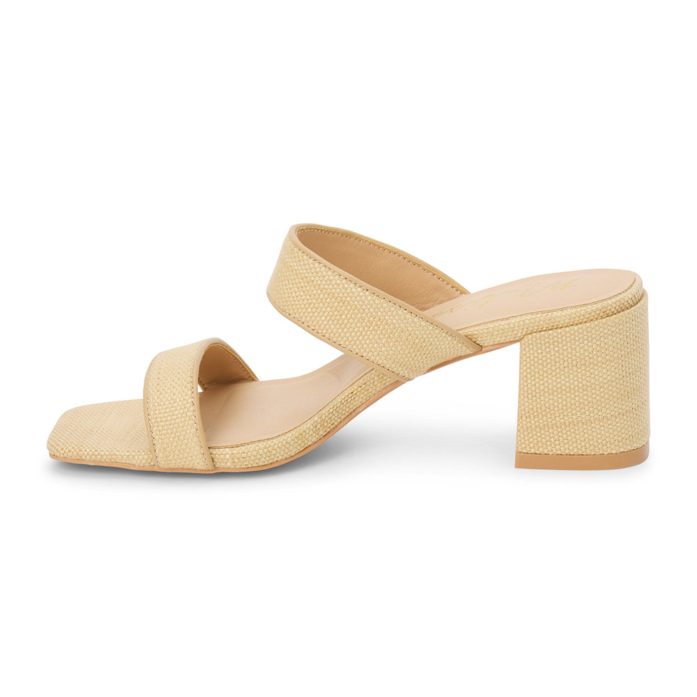 Beige vegan raffia heeled sandal with wide woven straps and block heel, shown on a white background.