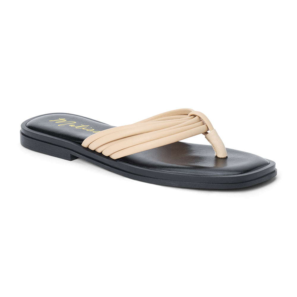 Beige leather flip flop sandal with multiple tubular straps gathered in a knotted design and a flat sole shown on a white background.