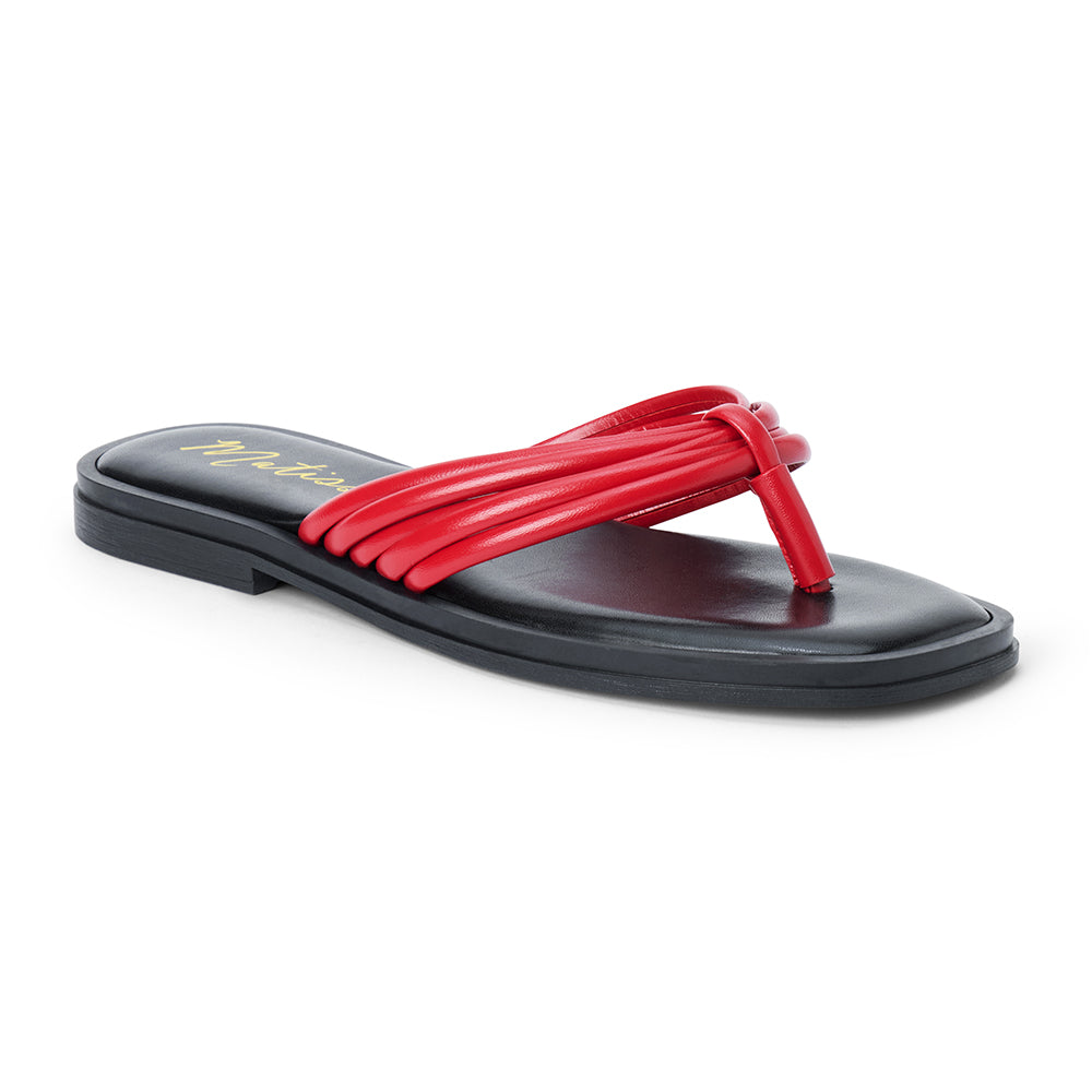 Red leather flip flop sandal with multiple tubular straps gathered in a knotted design and a flat sole shown on a white background.