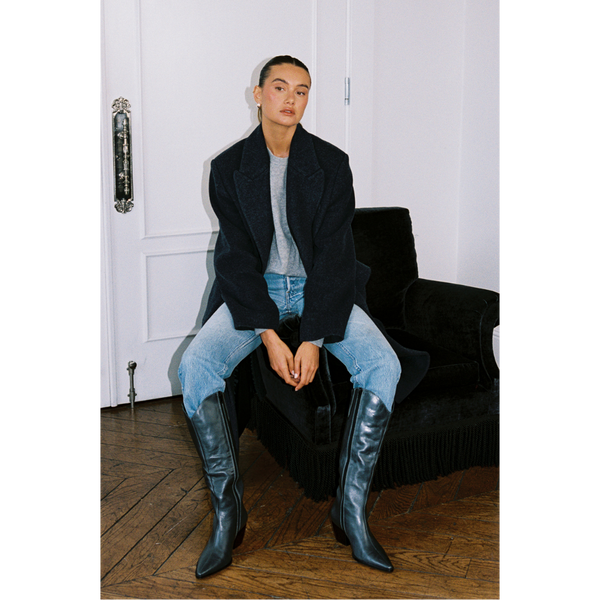 Bellamy Western Boot – Matisse Footwear – Black tall western-inspired boot with pointed toe, curved top shaft, and angled block heel in distressed leather.