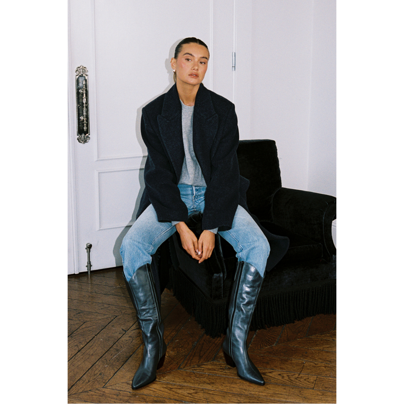Bellamy Western Boot – Matisse Footwear – Black tall western-inspired boot with pointed toe, curved top shaft, and angled block heel in distressed leather.