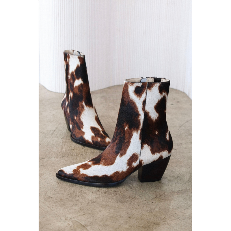 Caty Ankle Boot – Matisse Footwear – Cow-print haircalf ankle boot with a pointed toe, stacked block heel, and side zipper. A bold Western-inspired silhouette with statement-making texture.
